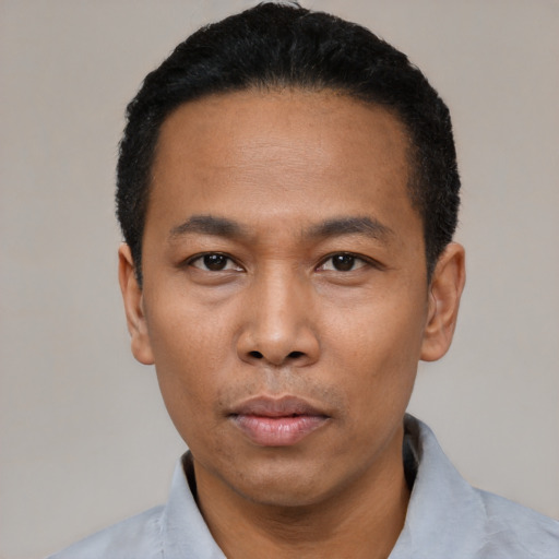 Neutral asian adult male with short  black hair and brown eyes