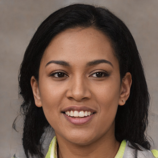 Joyful latino young-adult female with medium  black hair and brown eyes