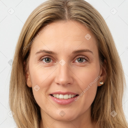 Joyful white young-adult female with long  brown hair and green eyes