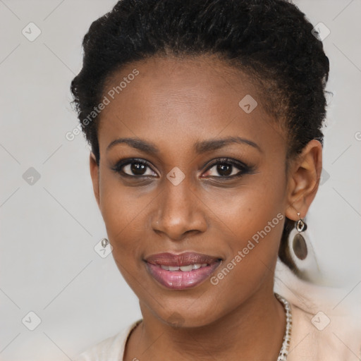 Joyful black young-adult female with short  brown hair and brown eyes