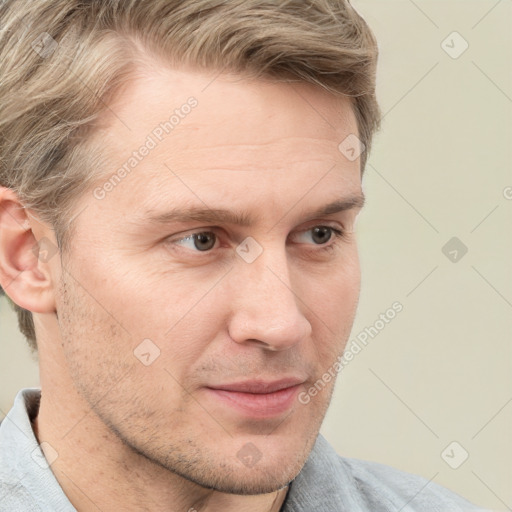 Joyful white adult male with short  brown hair and grey eyes