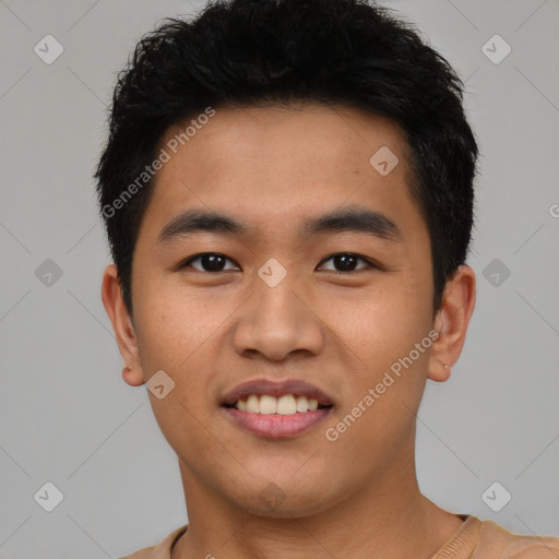 Joyful asian young-adult male with short  black hair and brown eyes