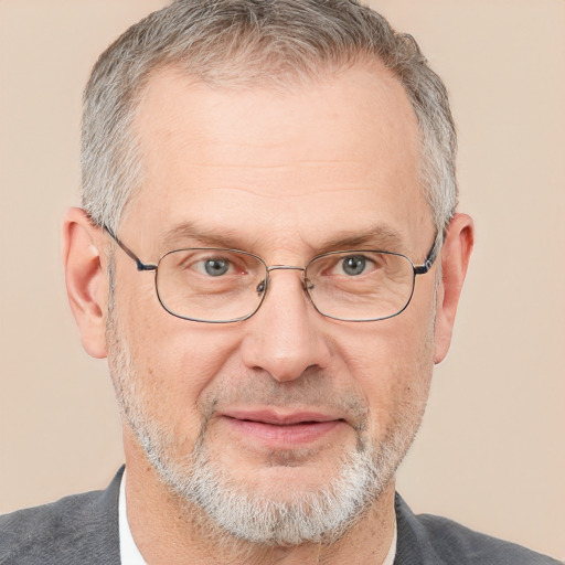 Joyful white middle-aged male with short  gray hair and brown eyes