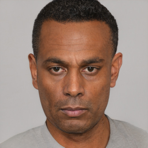 Neutral black adult male with short  black hair and brown eyes