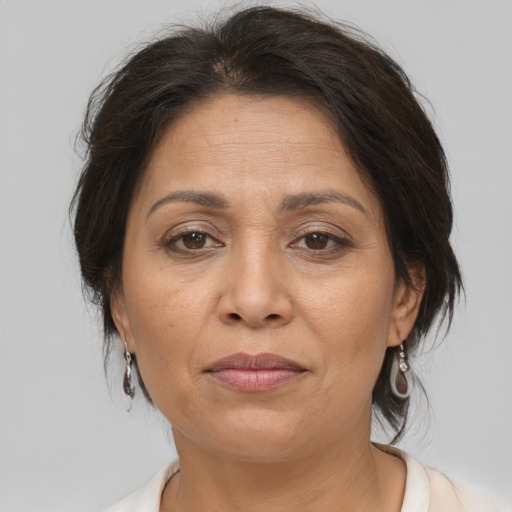 Joyful white adult female with medium  brown hair and brown eyes