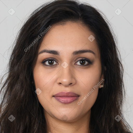 Joyful latino young-adult female with long  brown hair and brown eyes