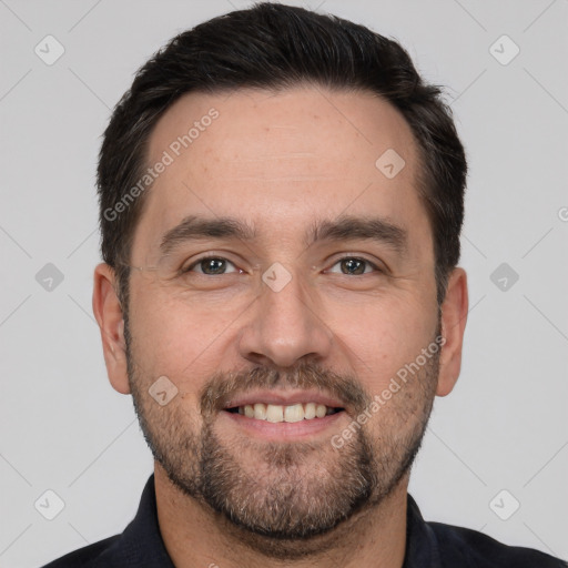 Joyful white adult male with short  brown hair and brown eyes