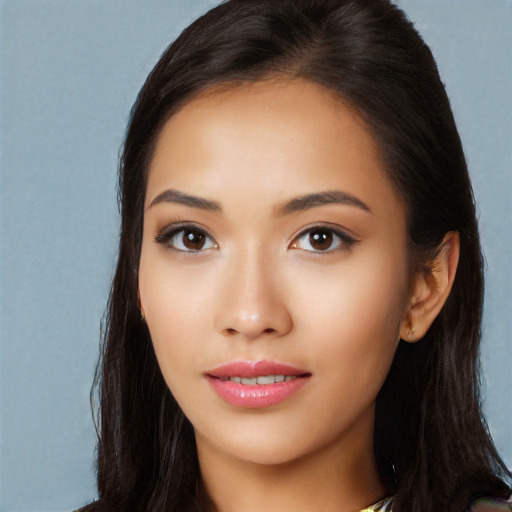 Joyful white young-adult female with long  black hair and brown eyes