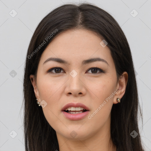 Joyful asian young-adult female with long  brown hair and brown eyes