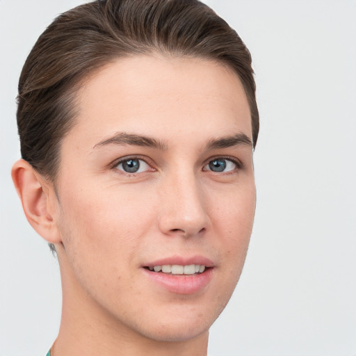 Joyful white young-adult female with short  brown hair and grey eyes