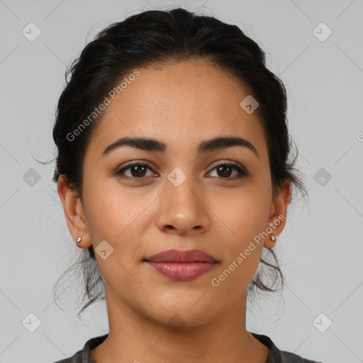 Joyful latino young-adult female with medium  brown hair and brown eyes