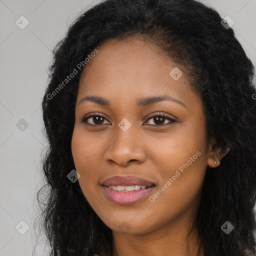 Joyful black young-adult female with long  black hair and brown eyes