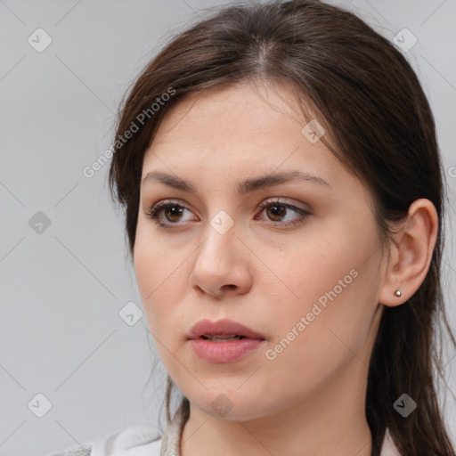 Neutral white young-adult female with medium  brown hair and brown eyes