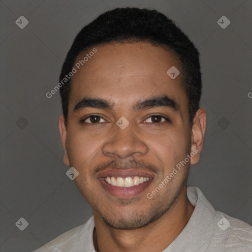 Joyful latino young-adult male with short  black hair and brown eyes