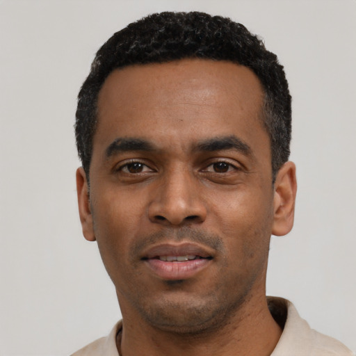 Neutral black young-adult male with short  black hair and brown eyes