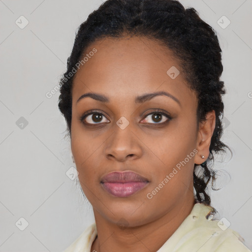 Joyful black young-adult female with short  black hair and brown eyes