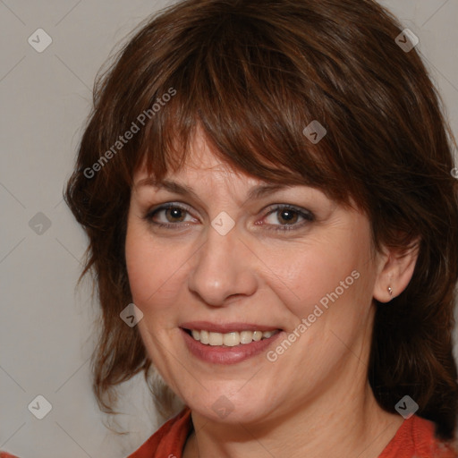 Joyful white adult female with medium  brown hair and brown eyes