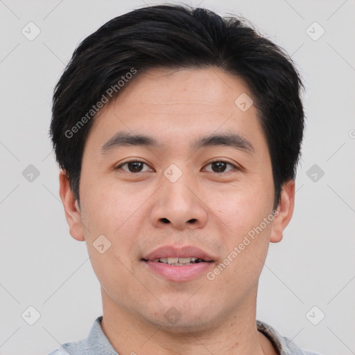 Joyful asian young-adult male with short  brown hair and brown eyes