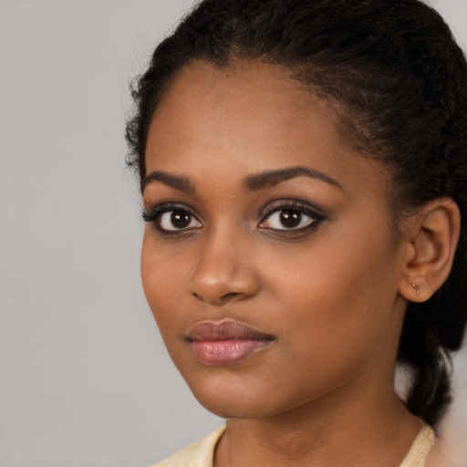 Neutral black young-adult female with long  black hair and brown eyes