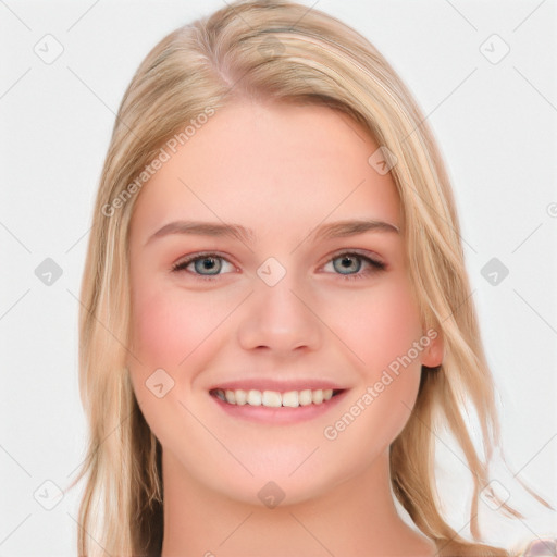 Joyful white young-adult female with long  brown hair and blue eyes