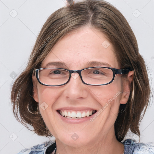 Joyful white adult female with medium  brown hair and blue eyes