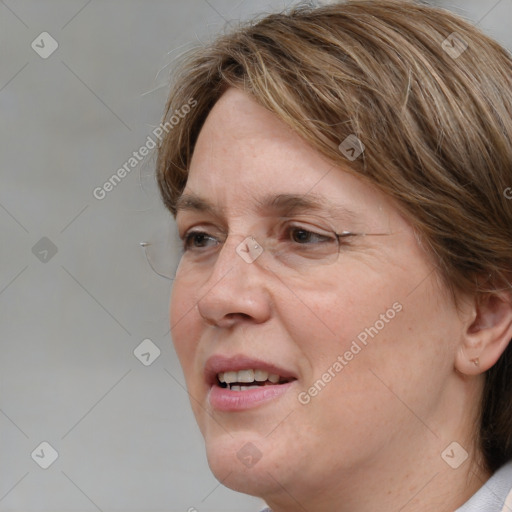 Joyful white adult female with medium  brown hair and blue eyes