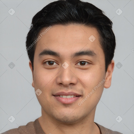 Joyful asian young-adult male with short  black hair and brown eyes