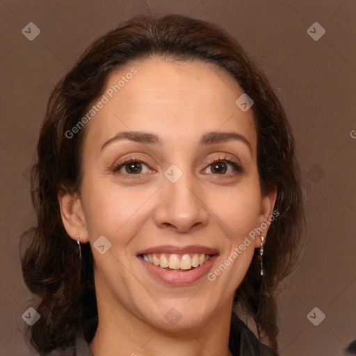 Joyful white adult female with long  brown hair and brown eyes