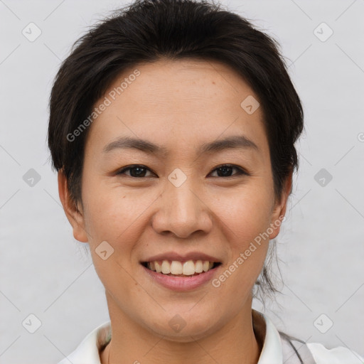 Joyful asian young-adult female with short  brown hair and brown eyes