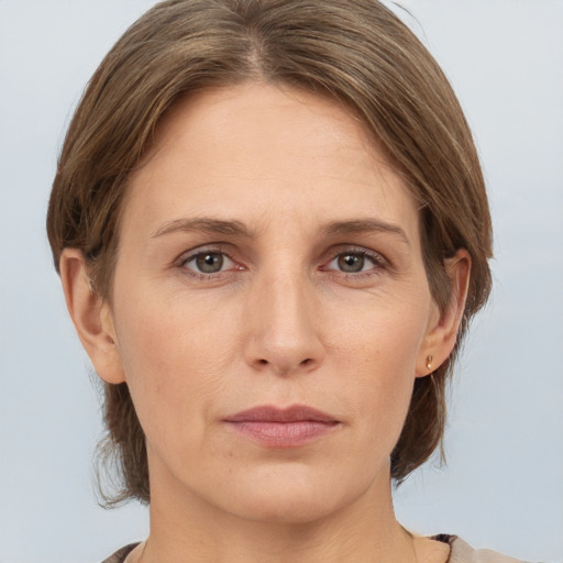 Neutral white adult female with medium  brown hair and grey eyes