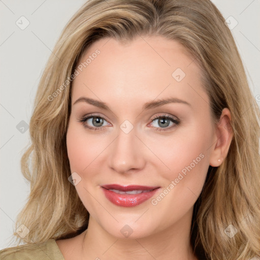 Joyful white young-adult female with long  brown hair and blue eyes