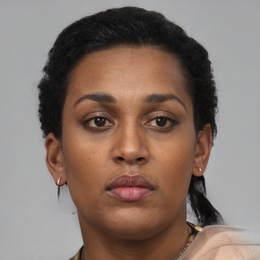 Neutral black young-adult female with short  brown hair and brown eyes