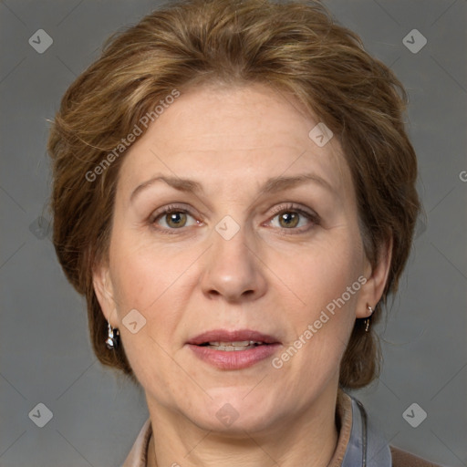 Joyful white adult female with medium  brown hair and grey eyes