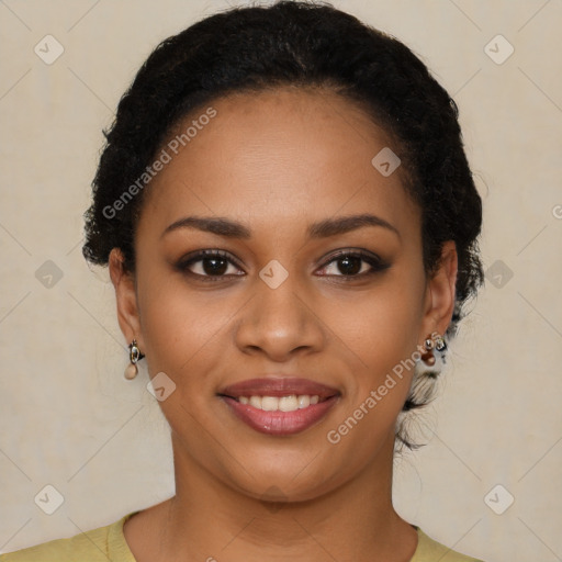 Joyful black young-adult female with short  black hair and brown eyes