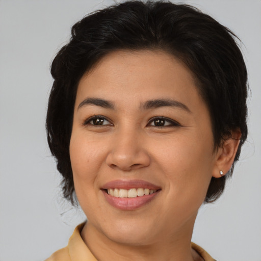 Joyful asian young-adult female with medium  brown hair and brown eyes