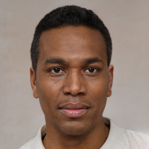 Neutral black young-adult male with short  black hair and brown eyes