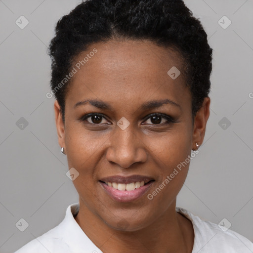 Joyful black young-adult female with short  black hair and brown eyes