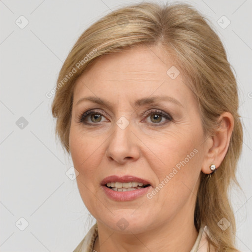 Joyful white adult female with medium  brown hair and brown eyes