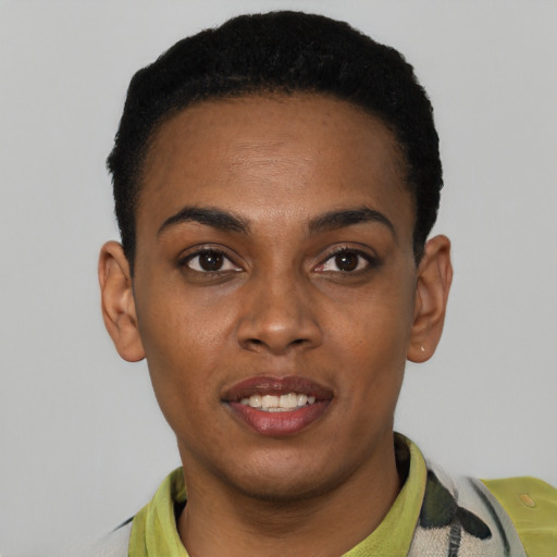 Joyful black young-adult female with short  black hair and brown eyes