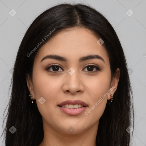 Joyful latino young-adult female with long  brown hair and brown eyes