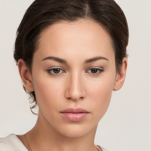 Neutral white young-adult female with short  brown hair and brown eyes