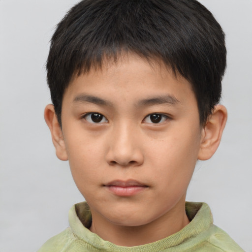 Neutral asian child male with short  brown hair and brown eyes