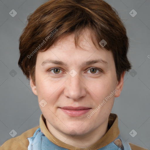 Joyful white adult female with short  brown hair and grey eyes