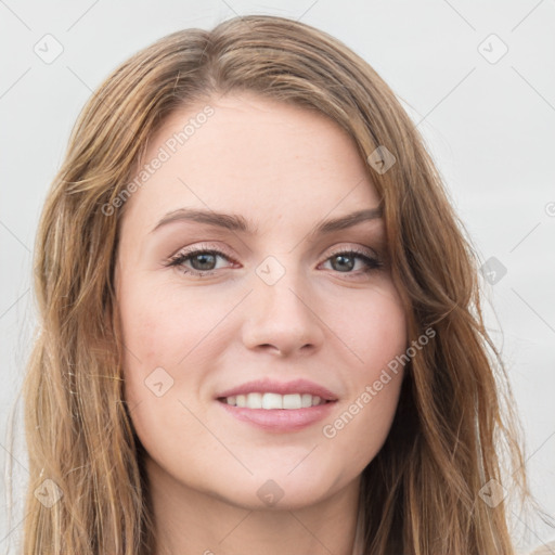 Joyful white young-adult female with long  brown hair and green eyes