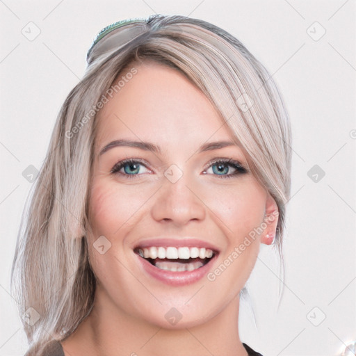 Joyful white young-adult female with long  brown hair and blue eyes