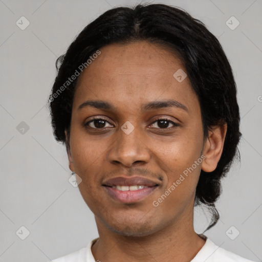 Joyful black adult female with short  black hair and brown eyes