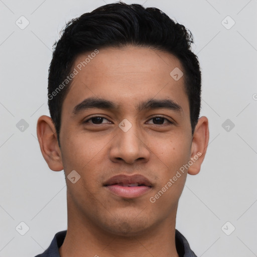 Joyful latino young-adult male with short  brown hair and brown eyes