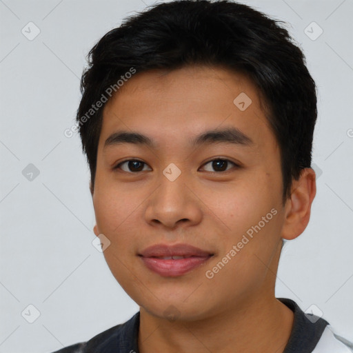 Joyful asian young-adult male with short  black hair and brown eyes