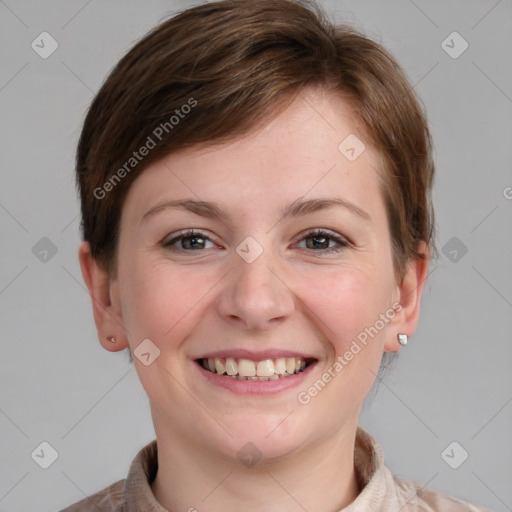 Joyful white young-adult female with short  brown hair and grey eyes