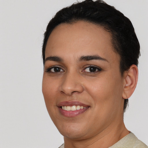 Joyful white young-adult female with short  black hair and brown eyes